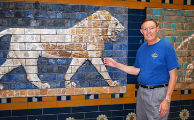 Ferrell Jenkins standing by a bull from Procession Street of ancient Babylon.